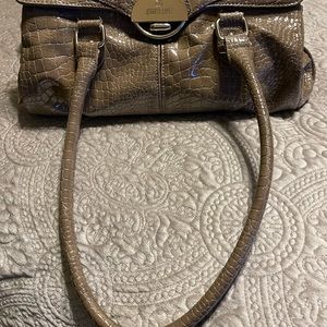Jennifer Lopez full size purse. Tan with many compartments.
